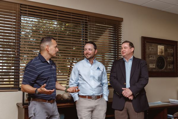 Chase Carlisle, Brian McDonald and Michael Urias standing together at the RTFC facility.