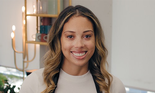 Hair salon owner smiling at camera