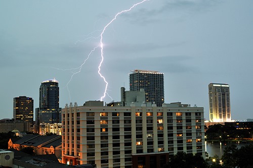 Lightning striking over a city