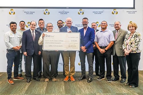 Texas Mutual presenting check to South Texas College